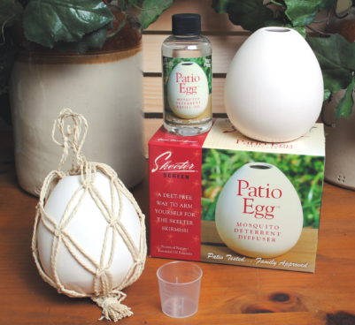 A white 'Patio Egg' mosquito deterrent with its packaging, indicating it's a decorative accessory that also serves as an insect repellent.